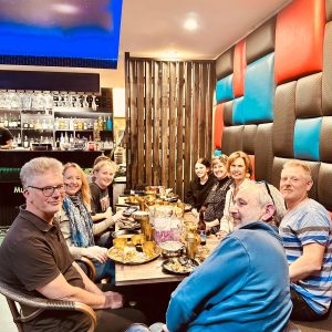 Group dining in a vibrant restaurant.